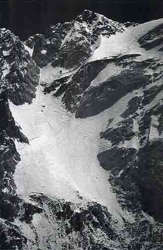 
Gasherbrum IV First Ascent West Face Central Spur - Gasherbrum IV Upper West face Showing Footsteps Leading to The Summit July 18, 1997 - American Alpine Journal
